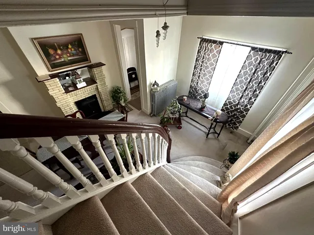 a utility room with dryer washer and a water heater