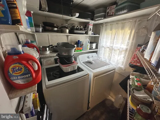a kitchen with a sink appliances and cabinets