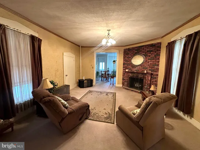 a close view of a fireplace and wooden floor