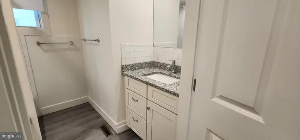 a bathroom with a sink and vanity