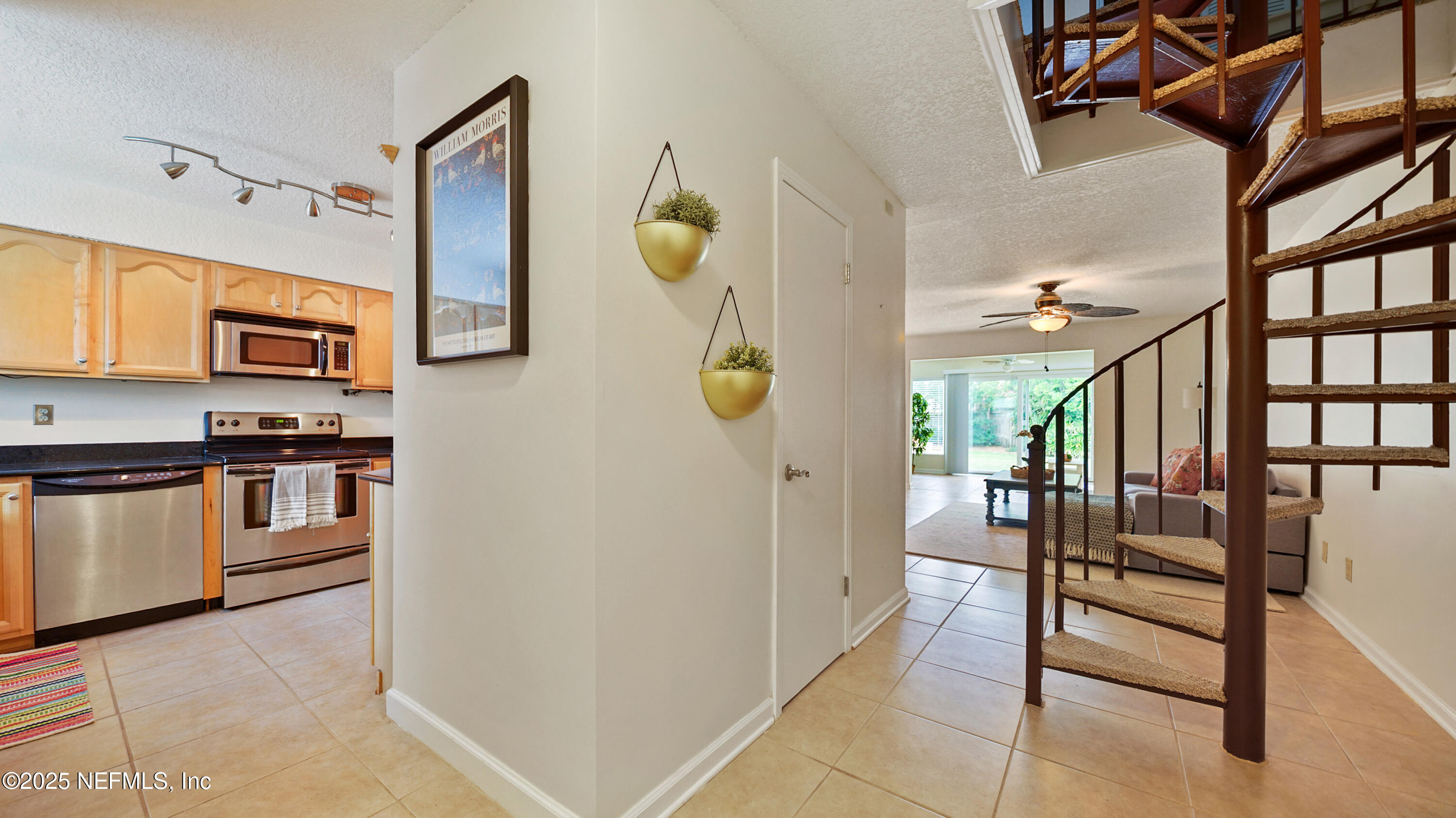 2233 Seminole Road, Unit 7 Atlantic Beach, FL 32233 - Photo 19 of 52 a kitchen with stainless steel appliances kitchen island granite countertop a refrigerator and stove