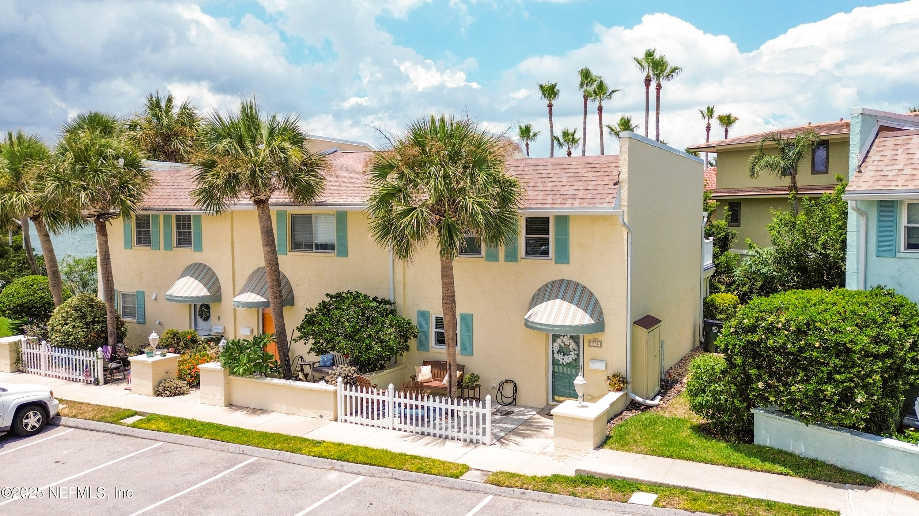 2233 Seminole Road, Unit 7 Atlantic Beach, FL 32233 - Photo 2 of 52 a front view of a house with a garden and plants