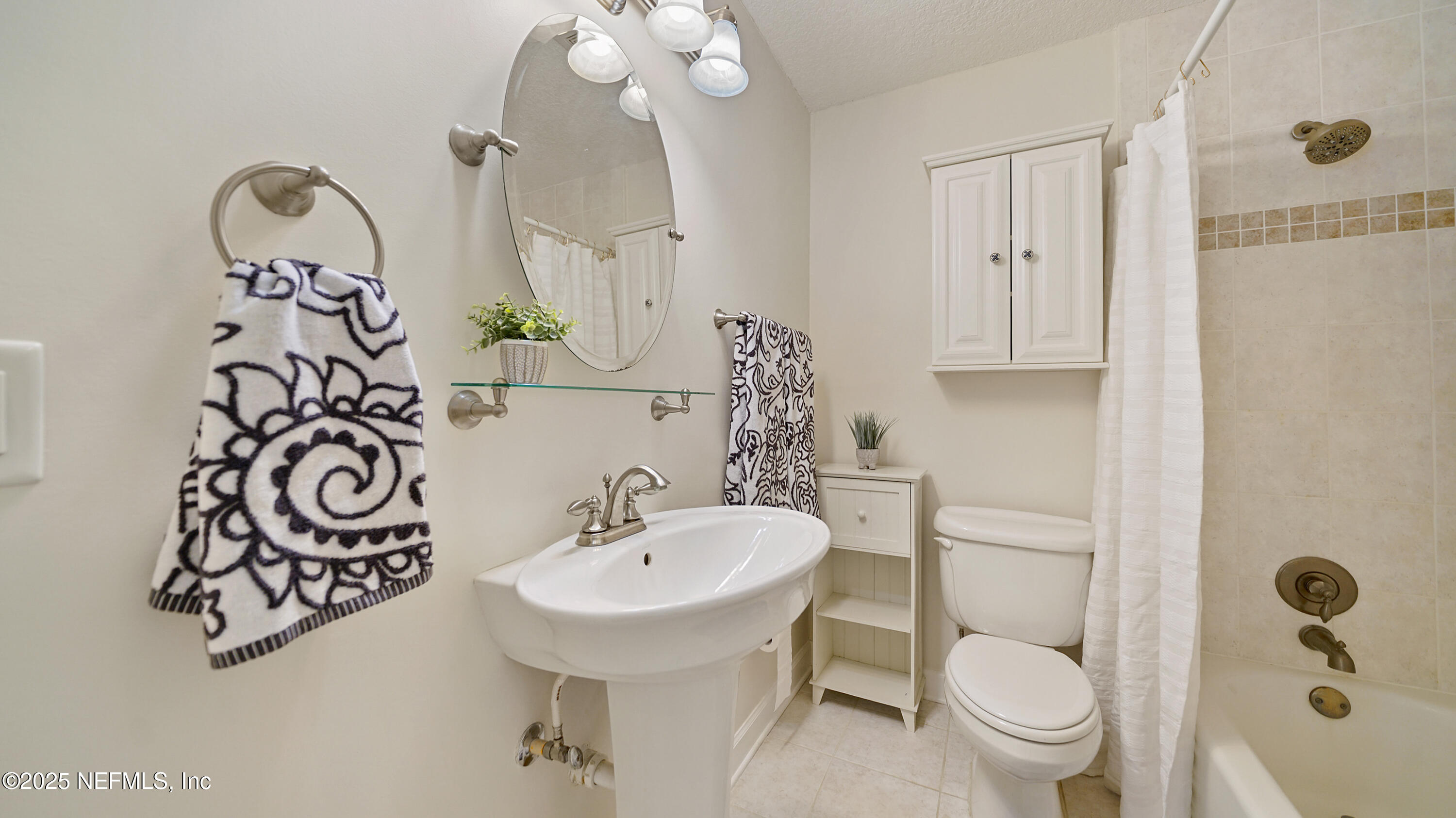 2233 Seminole Road, Unit 7 Atlantic Beach, FL 32233 - Photo 28 of 52 a bathroom with a toilet sink and mirror
