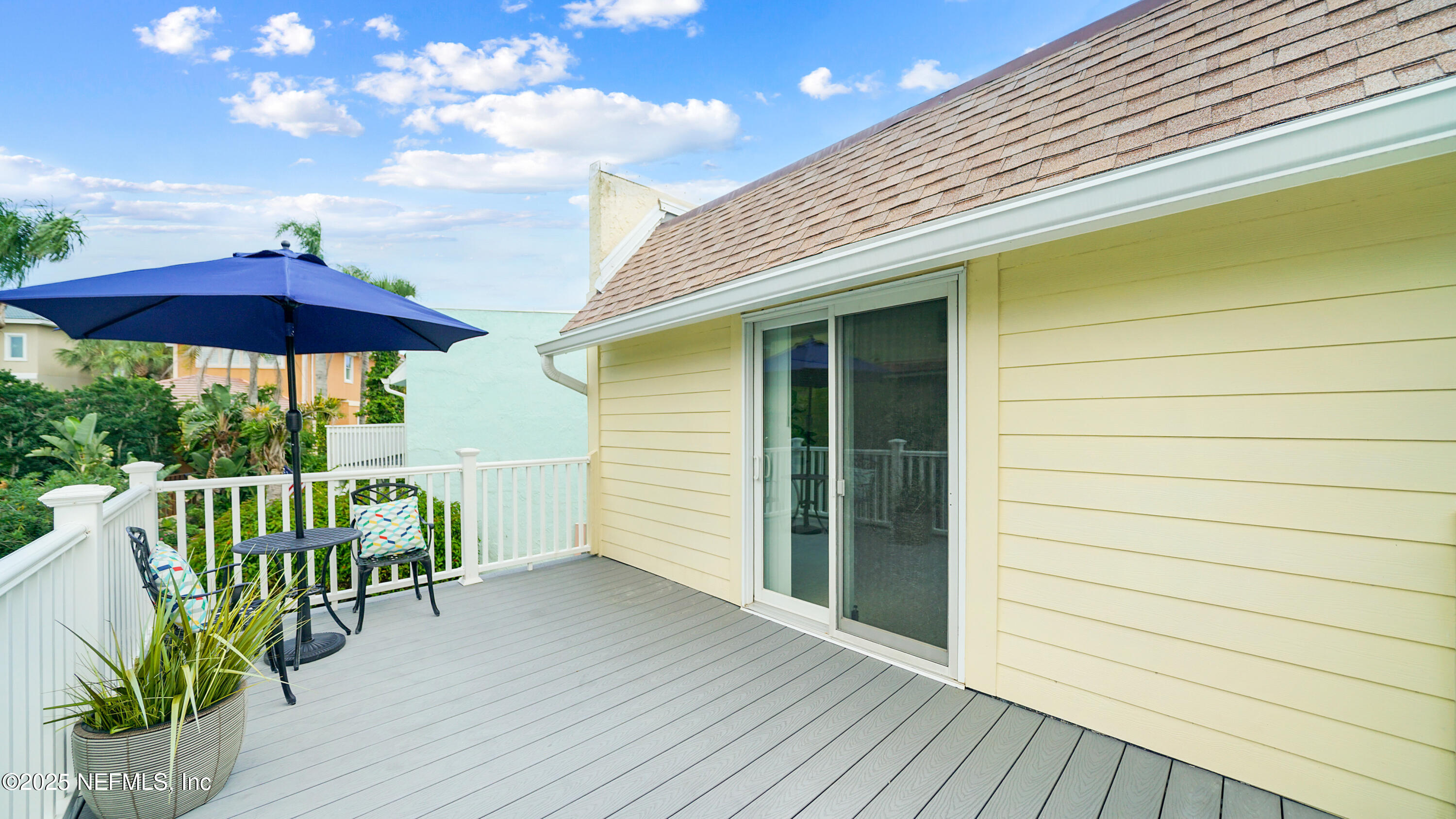 2233 Seminole Road, Unit 7 Atlantic Beach, FL 32233 - Photo 32 of 52 a balcony with furniture and wooden floor
