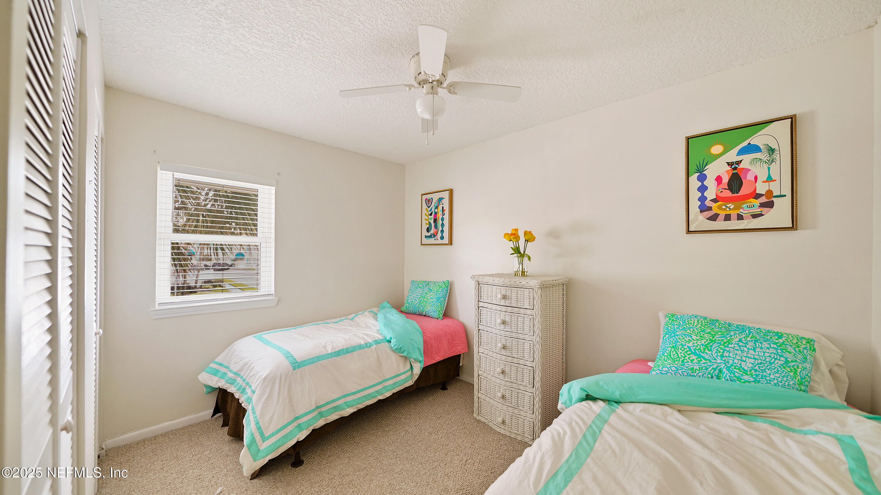 2233 Seminole Road, Unit 7 Atlantic Beach, FL 32233 - Photo 35 of 52 a bedroom with a bed and a chandelier