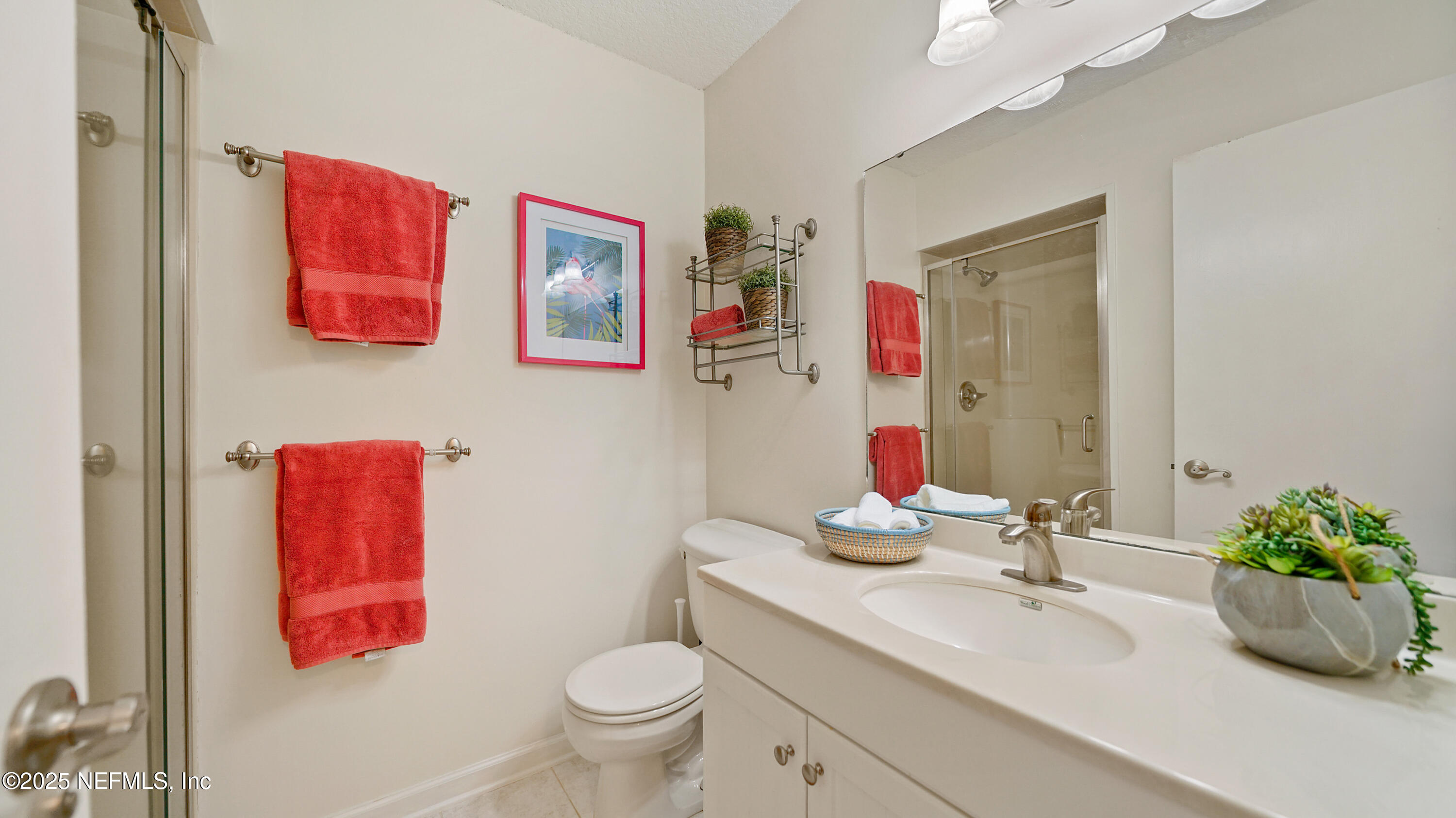 2233 Seminole Road, Unit 7 Atlantic Beach, FL 32233 - Photo 36 of 52 a bathroom with a sink mirror vanity and toilet
