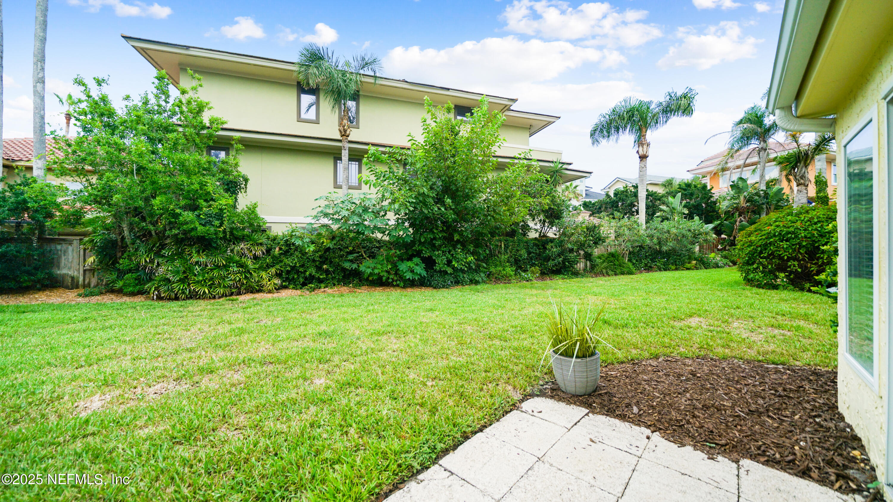 2233 Seminole Road, Unit 7 Atlantic Beach, FL 32233 - Photo 44 of 52 a front view of a house with garden