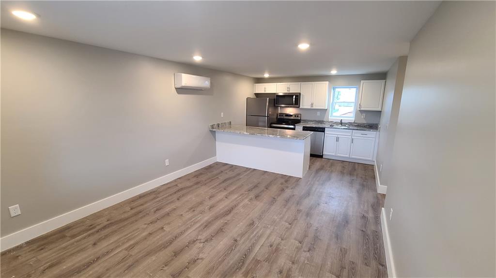 1331 Freeport Road Cheswick, PA 15024 - Photo 1 of 32 a kitchen with a sink and wooden floor