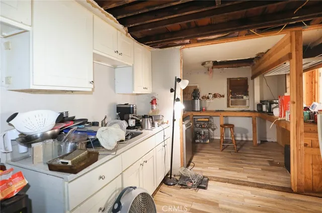 a kitchen with a sink and cabinets