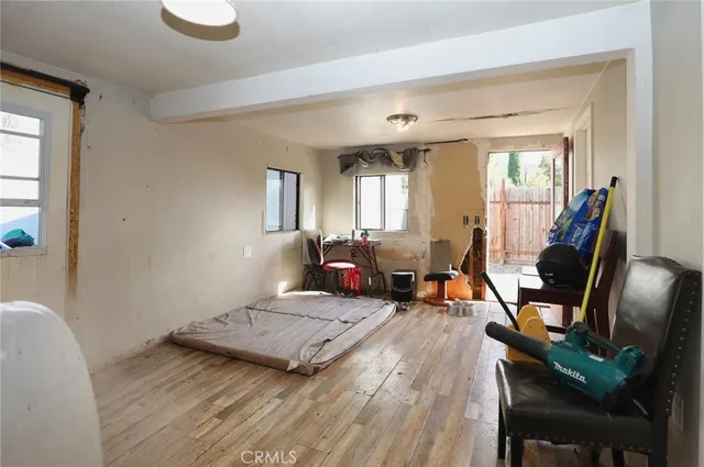 a living room with furniture rug and a window