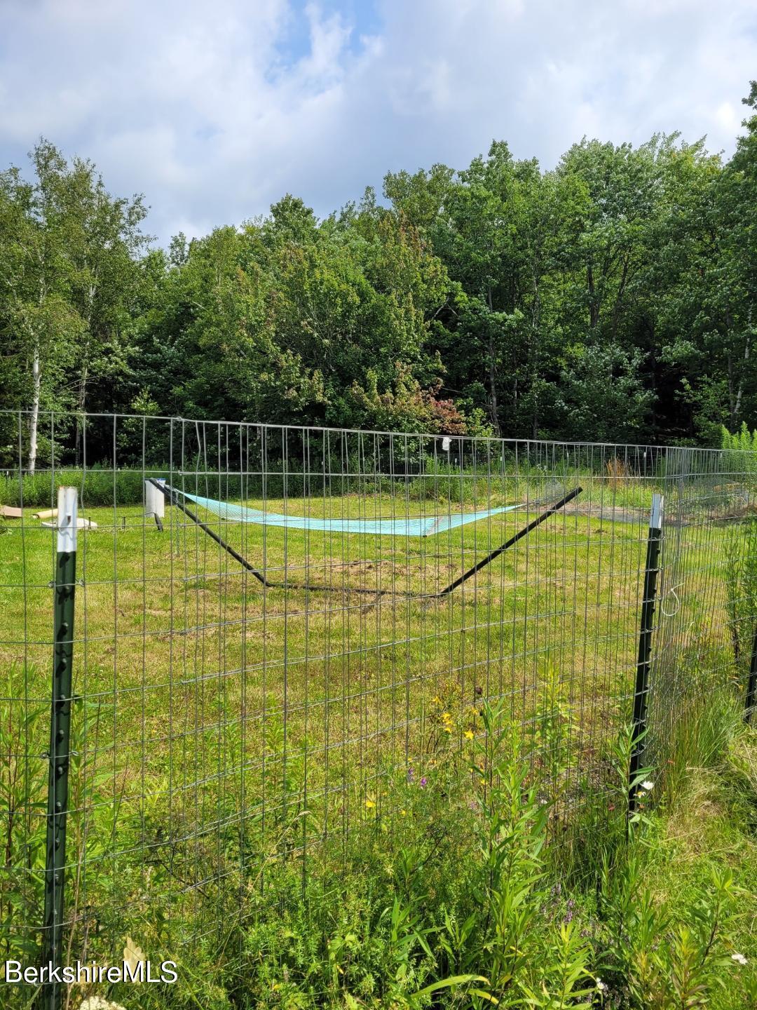 16 West Main Road Peru, MA 01235 - Photo 3 of 15 a view of a swimming pool with a yard