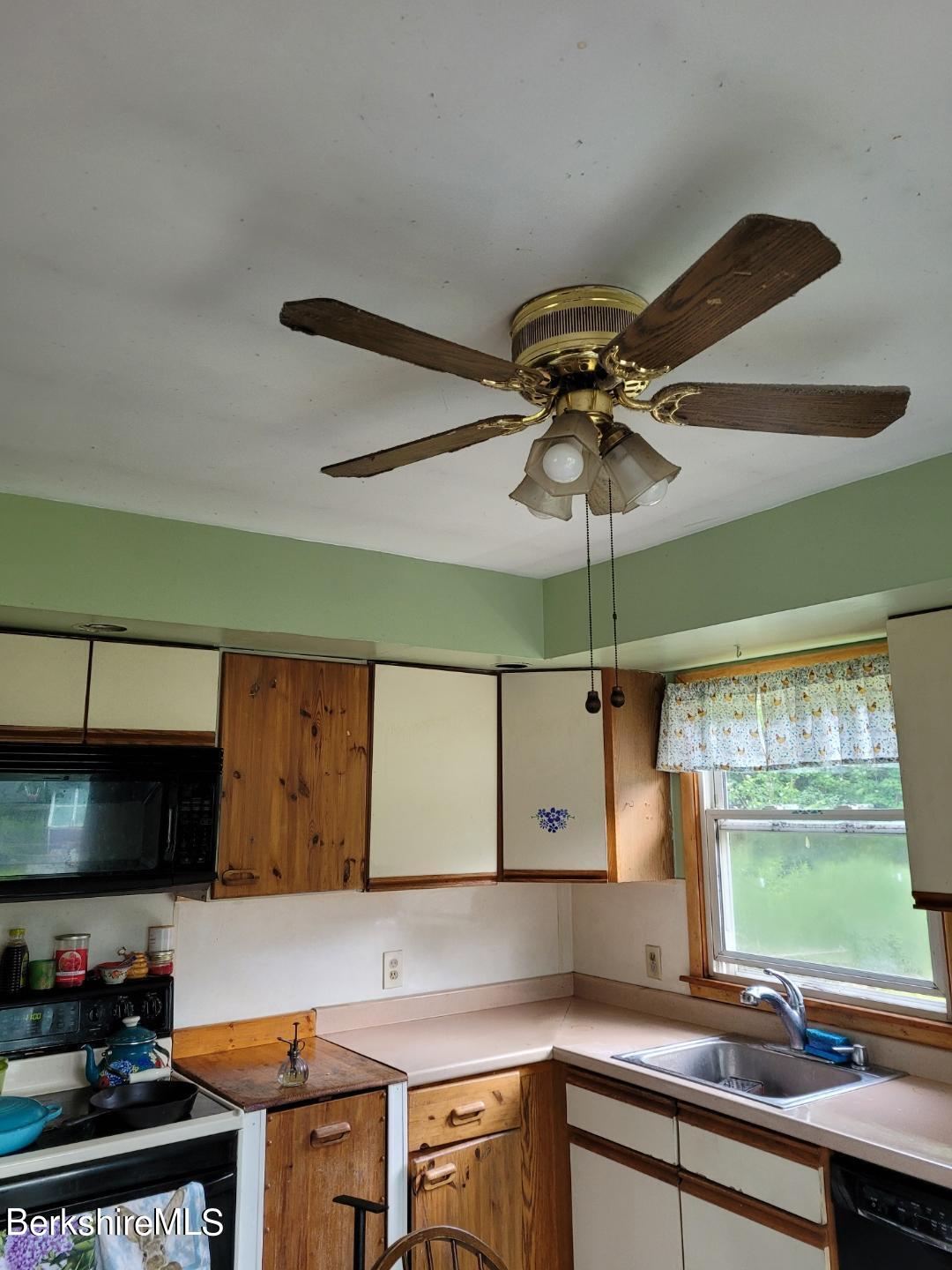 16 West Main Road Peru, MA 01235 - Photo 6 of 15 a kitchen with a sink cabinets and a large window
