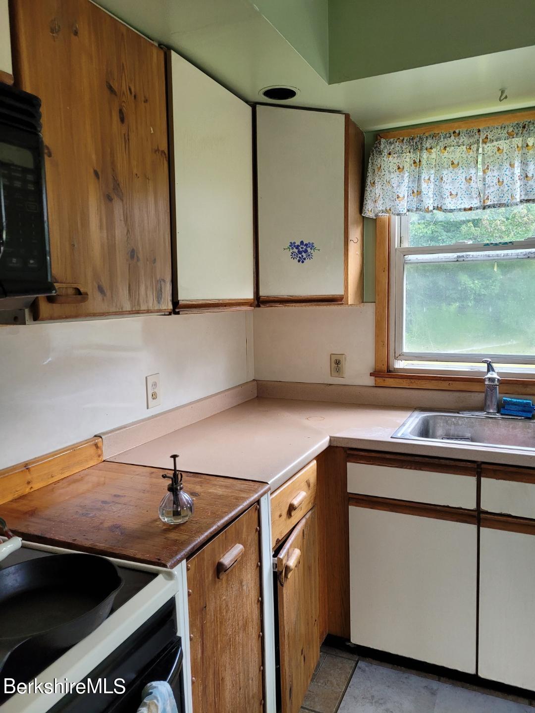 16 West Main Road Peru, MA 01235 - Photo 7 of 15 a kitchen with a sink cabinets and a window