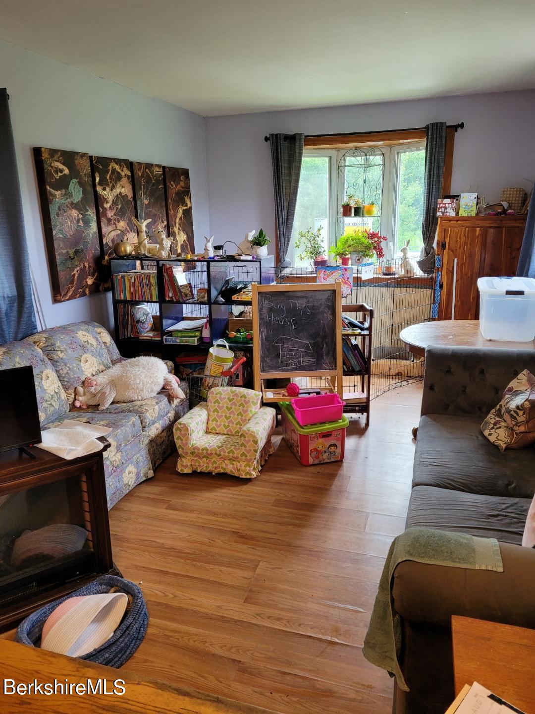 16 West Main Road Peru, MA 01235 - Photo 9 of 15 a living room with furniture and a large window