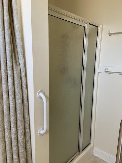 103 Dancer Lane Oak Ridge, TN 37830 - Photo 15 of 26 a bathroom with a glass shower door