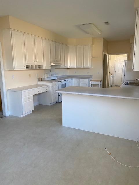 103 Dancer Lane Oak Ridge, TN 37830 - Photo 8 of 26 a kitchen with cabinets and window