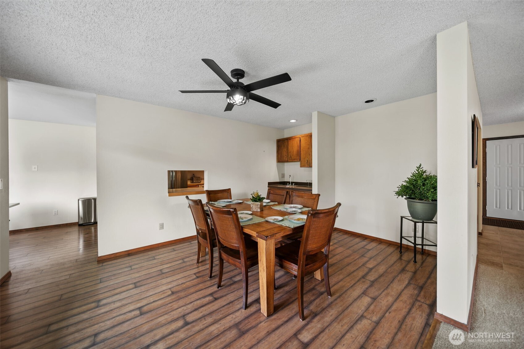 225 19th Street Northeast, Unit 23 East Wenatchee, WA 98802 - Photo 11 of 40 a view of a dining room with furniture and wooden floor