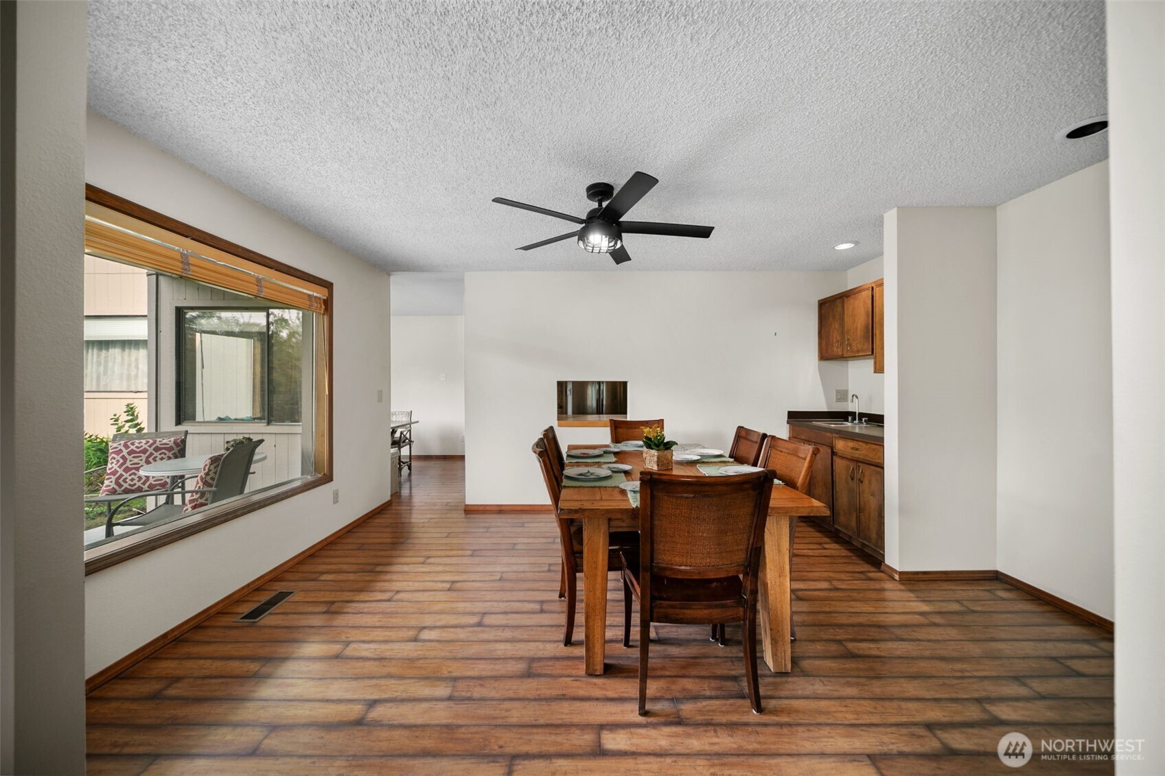 225 19th Street Northeast, Unit 23 East Wenatchee, WA 98802 - Photo 12 of 40 a view of a dining room with furniture window and wooden floor