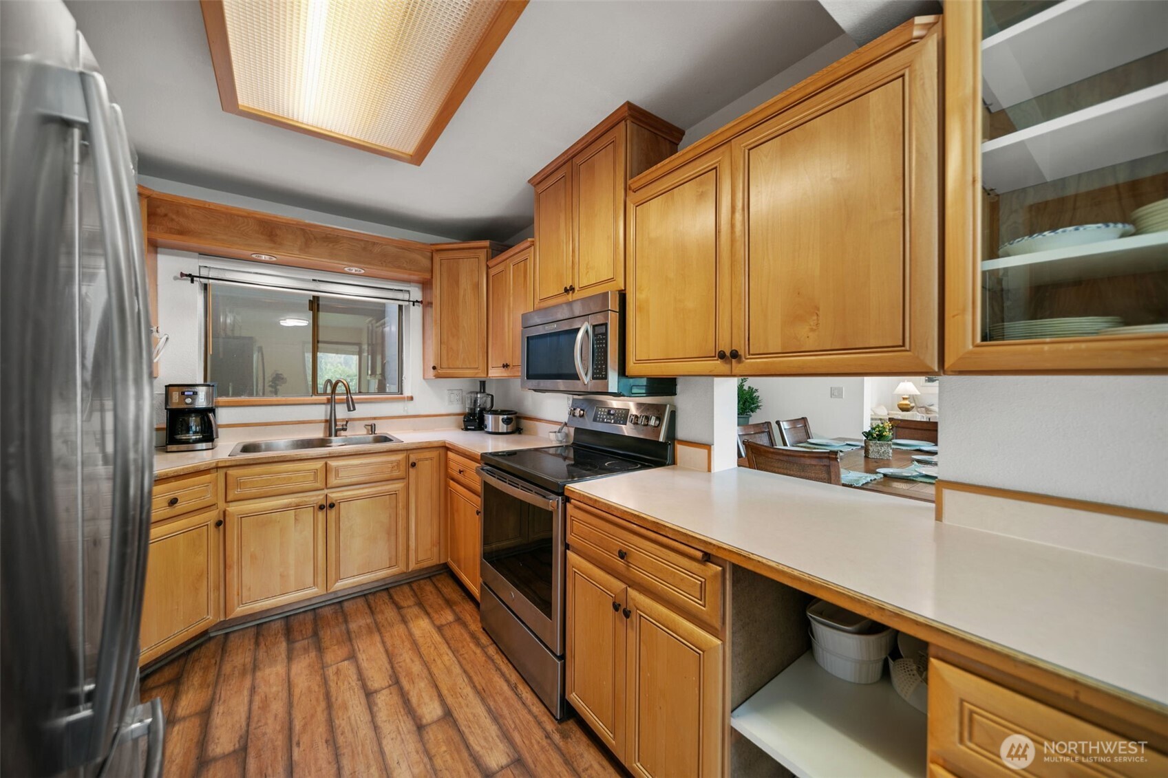 225 19th Street Northeast, Unit 23 East Wenatchee, WA 98802 - Photo 17 of 40 a kitchen with a sink stove and cabinets