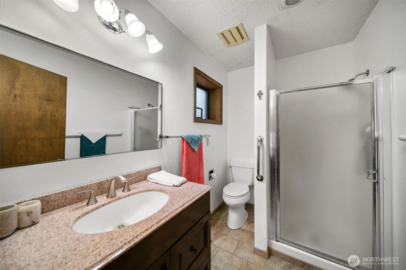 225 19th Street Northeast, Unit 23 East Wenatchee, WA 98802 - Photo 21 of 40 a bathroom with a granite countertop sink toilet and shower