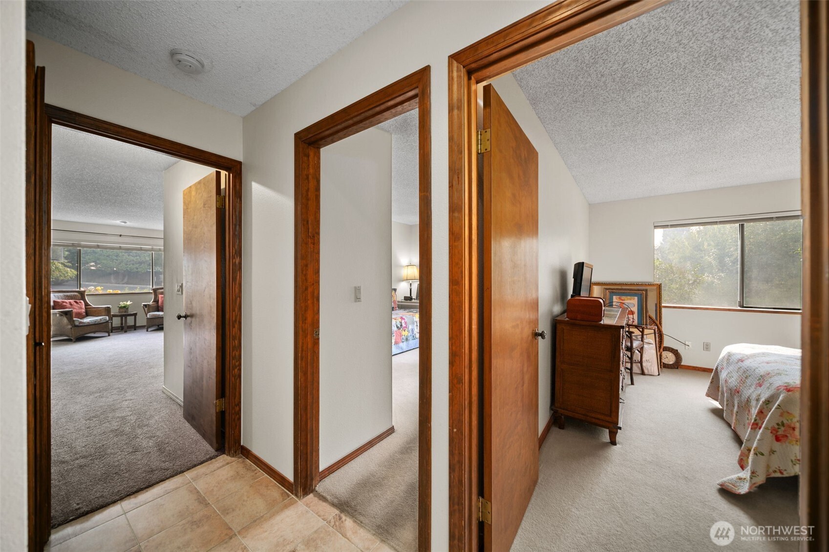 225 19th Street Northeast, Unit 23 East Wenatchee, WA 98802 - Photo 23 of 40 a view of a hallway with living room and furniture