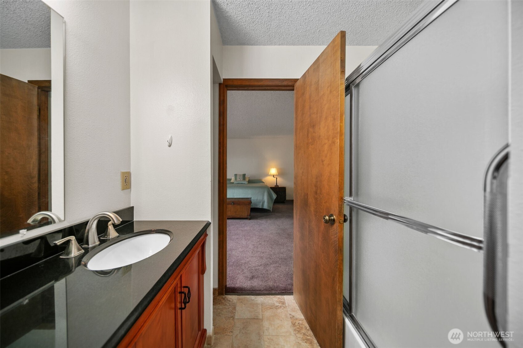 225 19th Street Northeast, Unit 23 East Wenatchee, WA 98802 - Photo 30 of 40 a bathroom with a sink and mirror