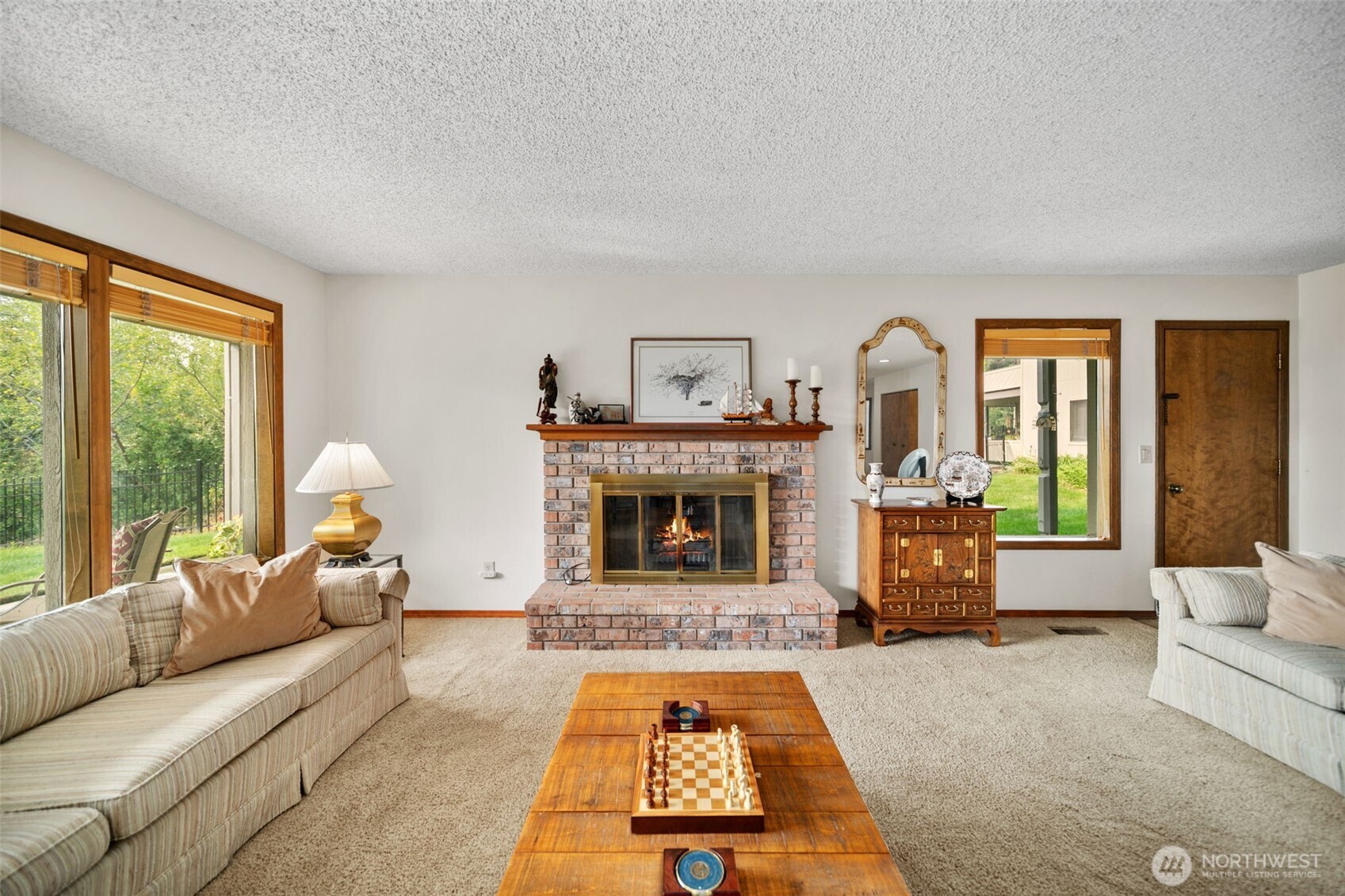 225 19th Street Northeast, Unit 23 East Wenatchee, WA 98802 - Photo 8 of 40 a living room with furniture and a fireplace