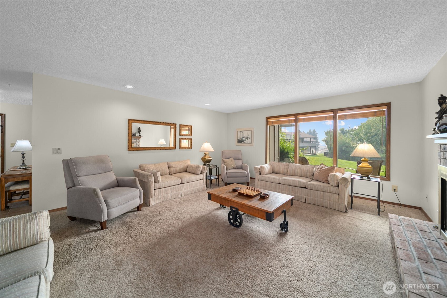 225 19th Street Northeast, Unit 23 East Wenatchee, WA 98802 - Photo 9 of 40 a living room with furniture and a large window