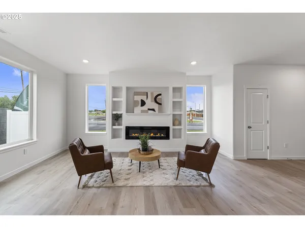 a living room with furniture and a window