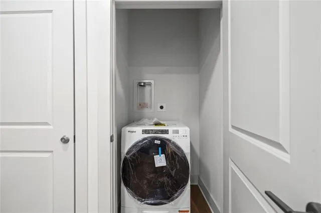 a utility room with washing machine
