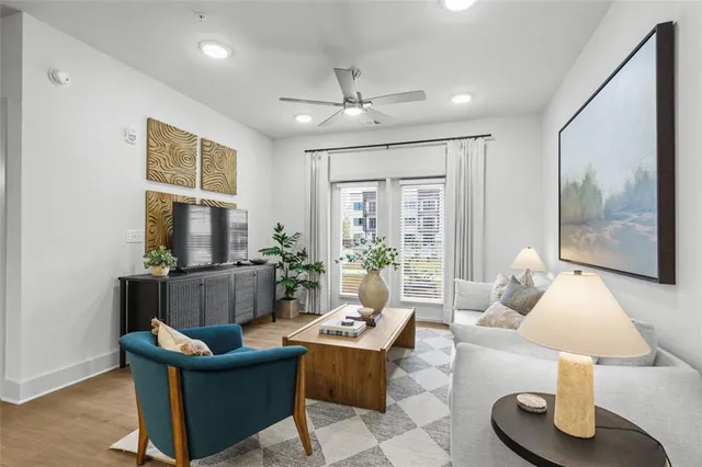 a living room with furniture and a flat screen tv