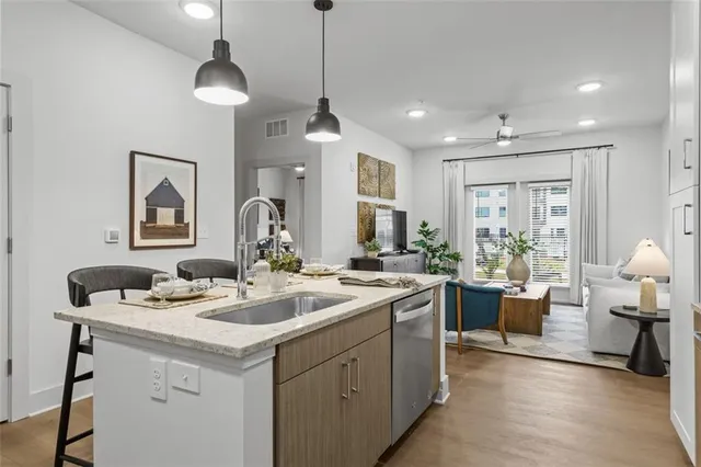 a kitchen with a sink stove and cabinets