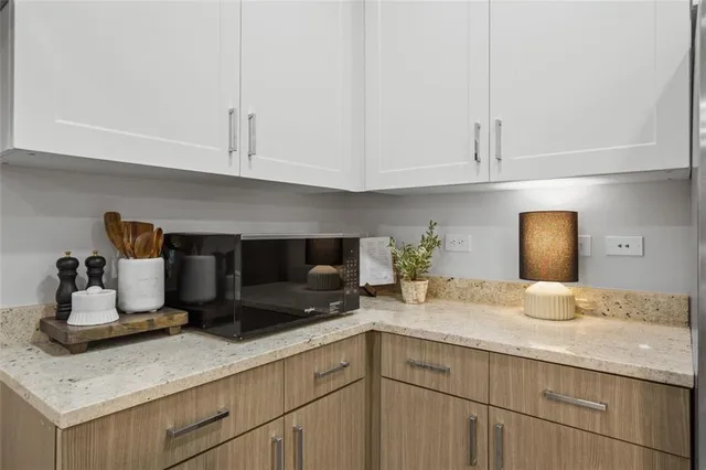 a kitchen with cabinets and window
