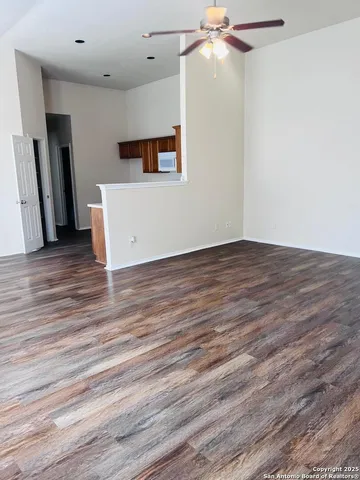 a view of a livingroom with wooden floor