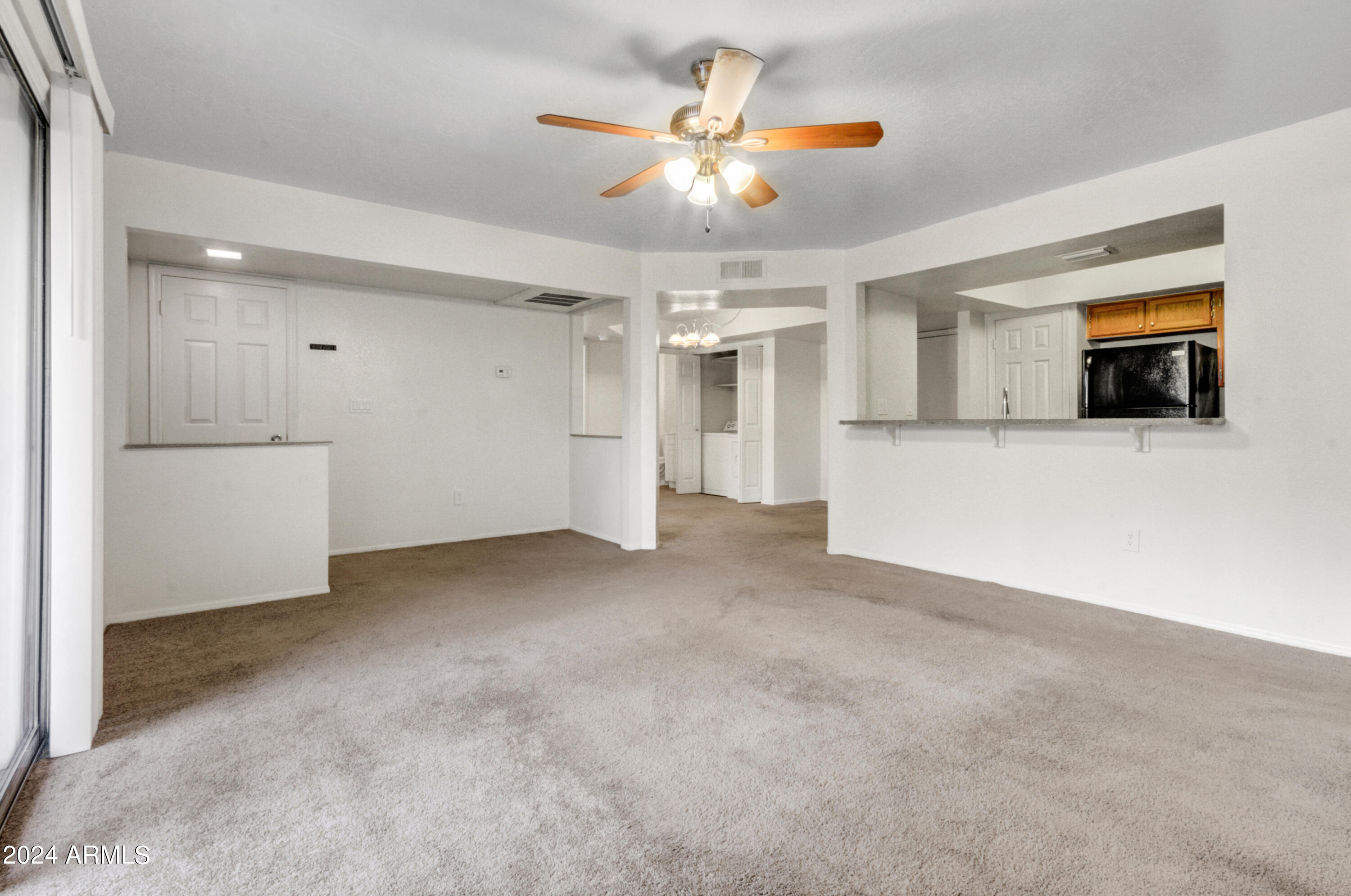 1331 West Baseline Road, Unit 118 Mesa, AZ 85202 - Photo 7 of 21 007_Living Room to Kitchen