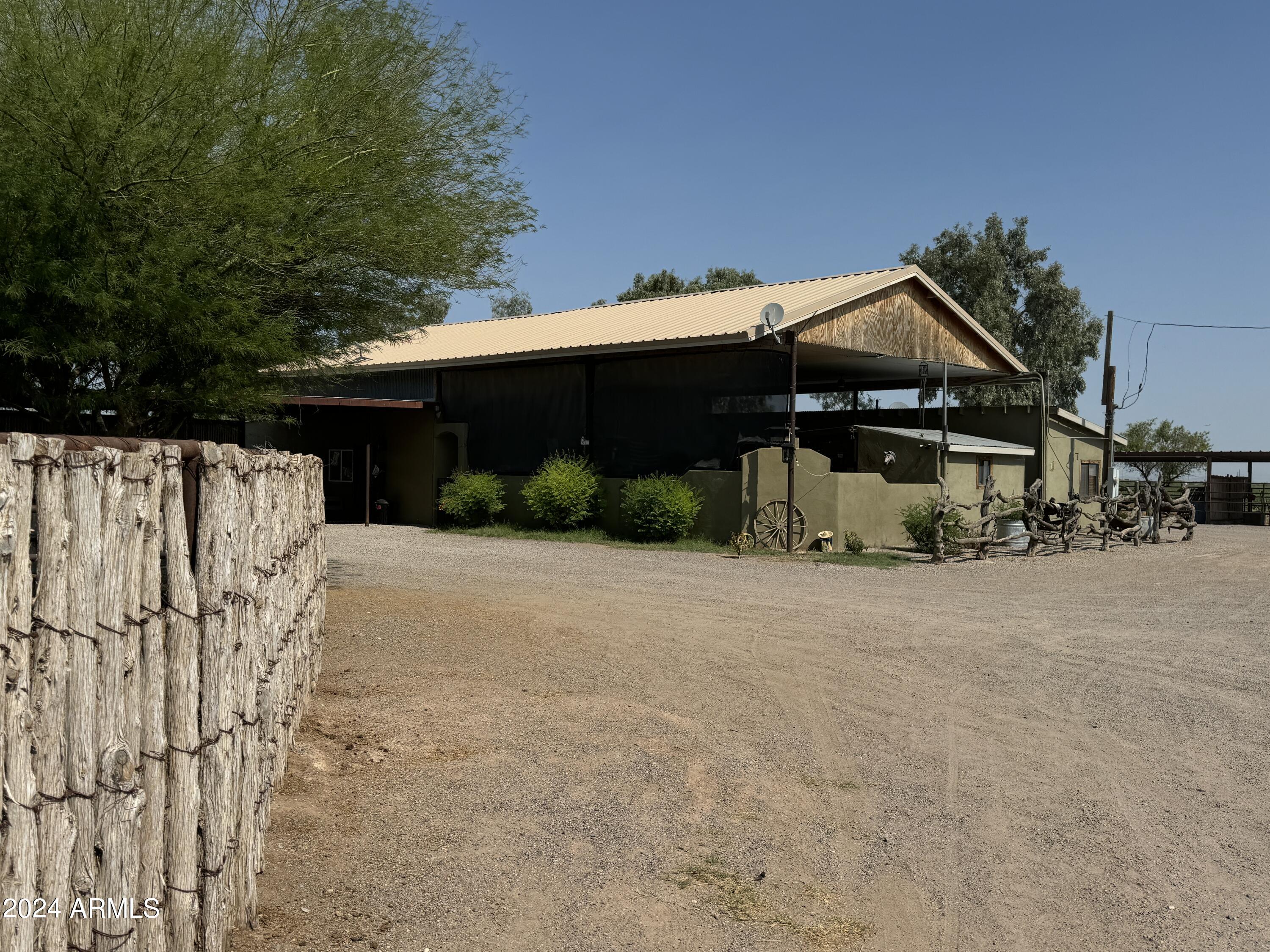 642 East Cornman Road Coolidge, AZ 85128 - Photo 11 of 64 a front view of a house with a yard and garage