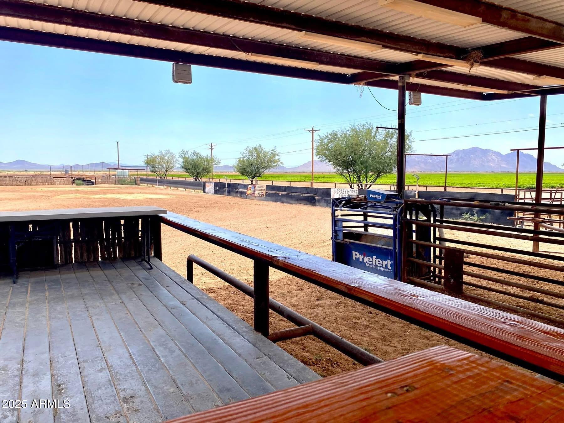 642 East Cornman Road Coolidge, AZ 85128 - Photo 3 of 64 a view of a balcony with wooden floor and outdoor seating
