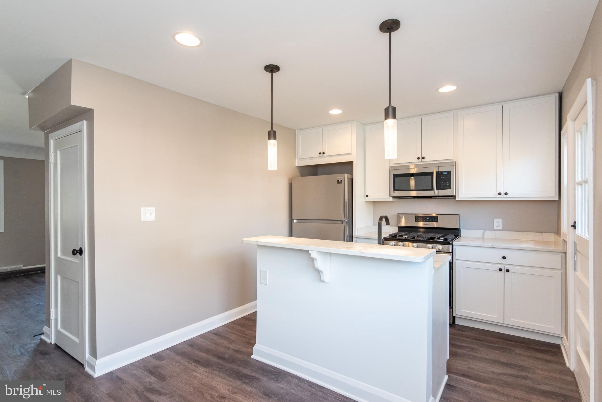 1812 Swansea Road Baltimore, MD 21239 - Photo 13 of 37 Flows from livingroom