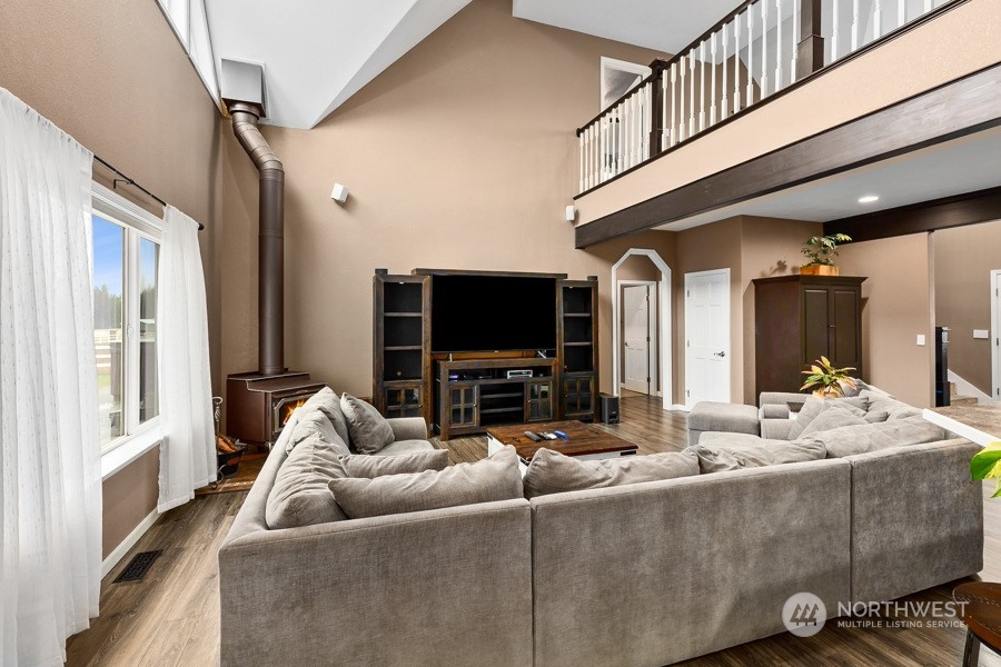 9600 Gastaeson Lane Southwest Rochester, WA 98579 - Photo 13 of 39 a living room with furniture tv and a fireplace