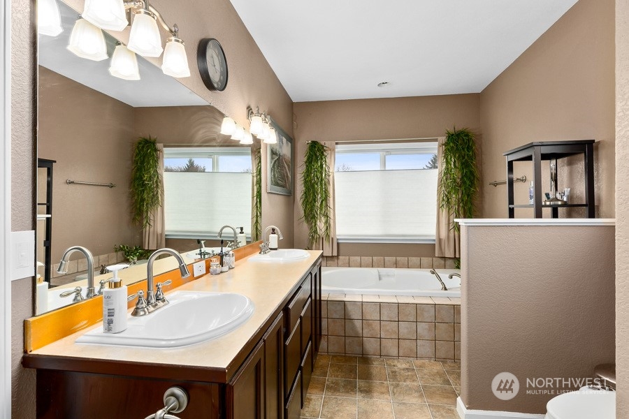 9600 Gastaeson Lane Southwest Rochester, WA 98579 - Photo 21 of 39 a bathroom with a sink and a mirror