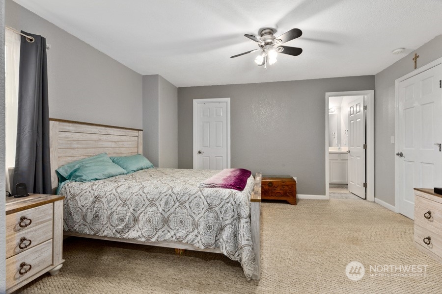 9600 Gastaeson Lane Southwest Rochester, WA 98579 - Photo 27 of 39 a bedroom with a bed and a dresser