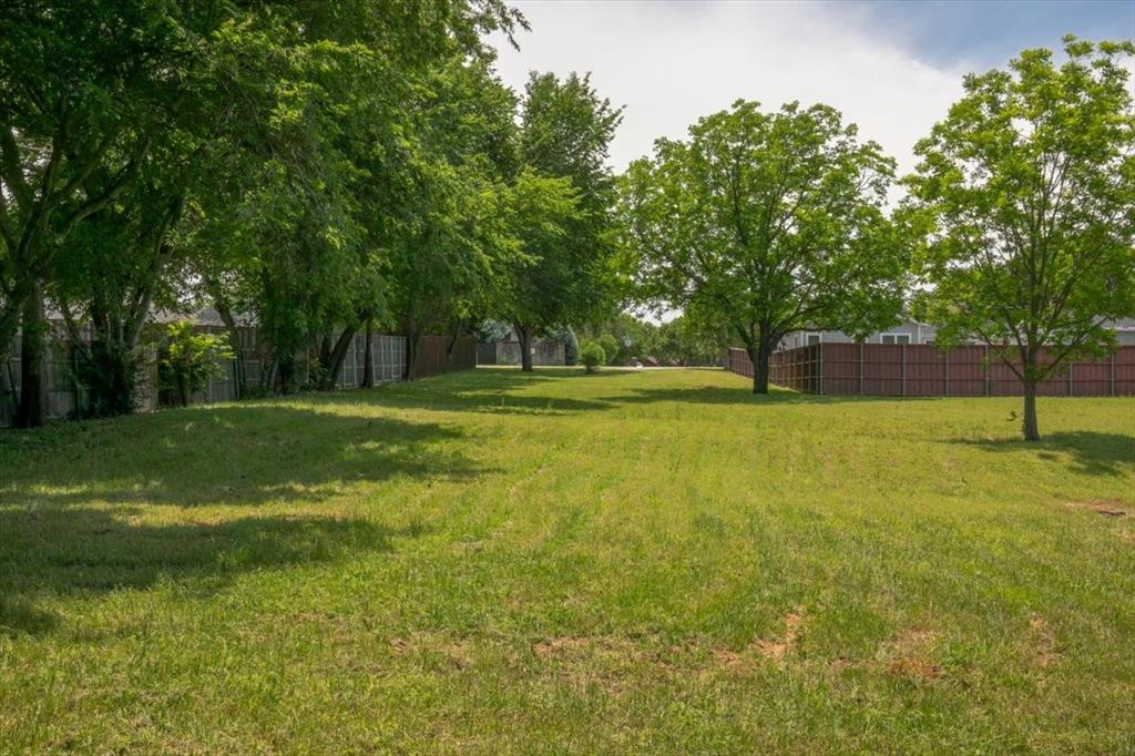 1000 Hughes Road Grapevine, TX 76051 - Photo 10 of 15 a backyard of a house with lots of green space