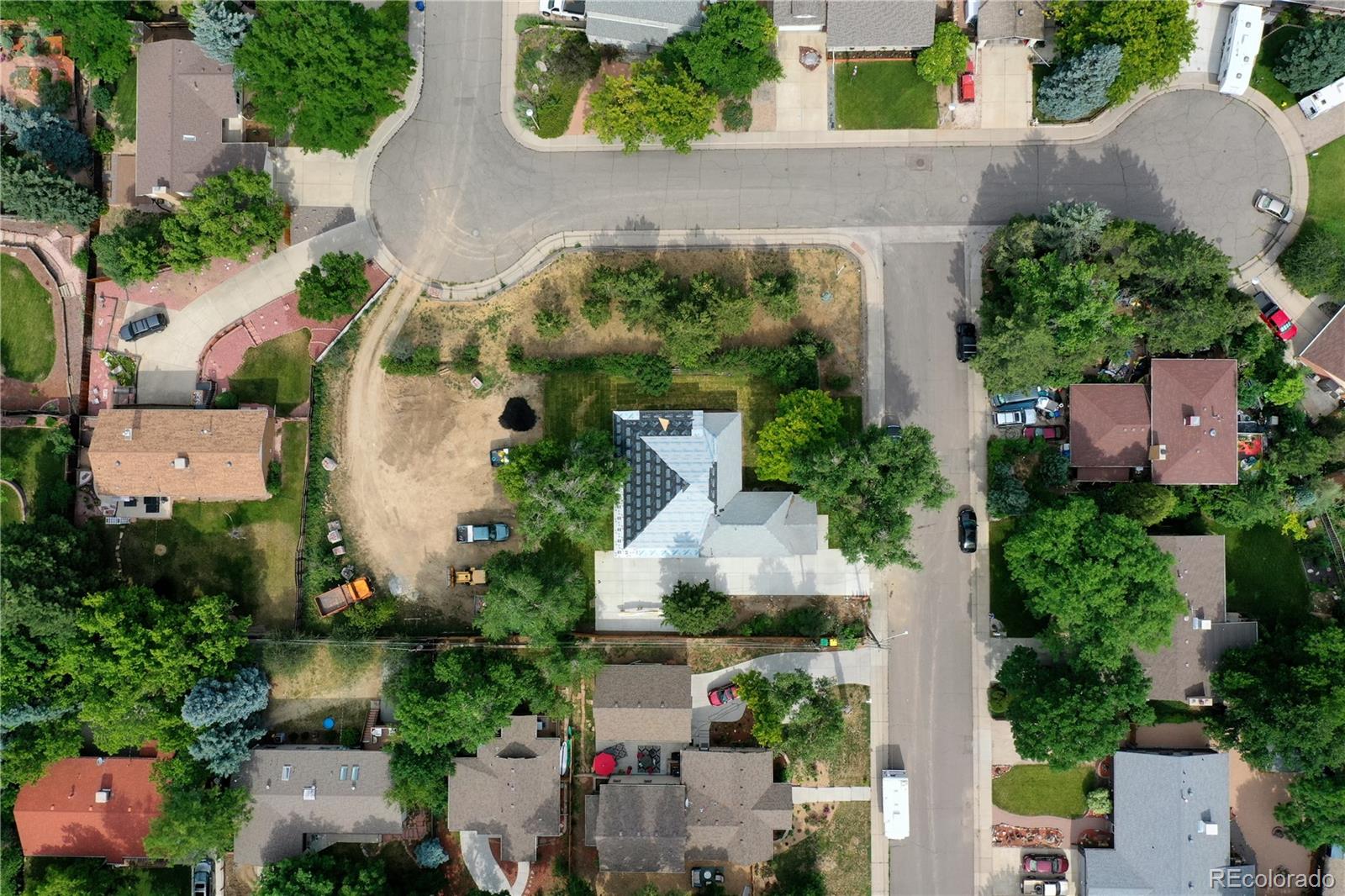 an aerial view of a house with outdoor space