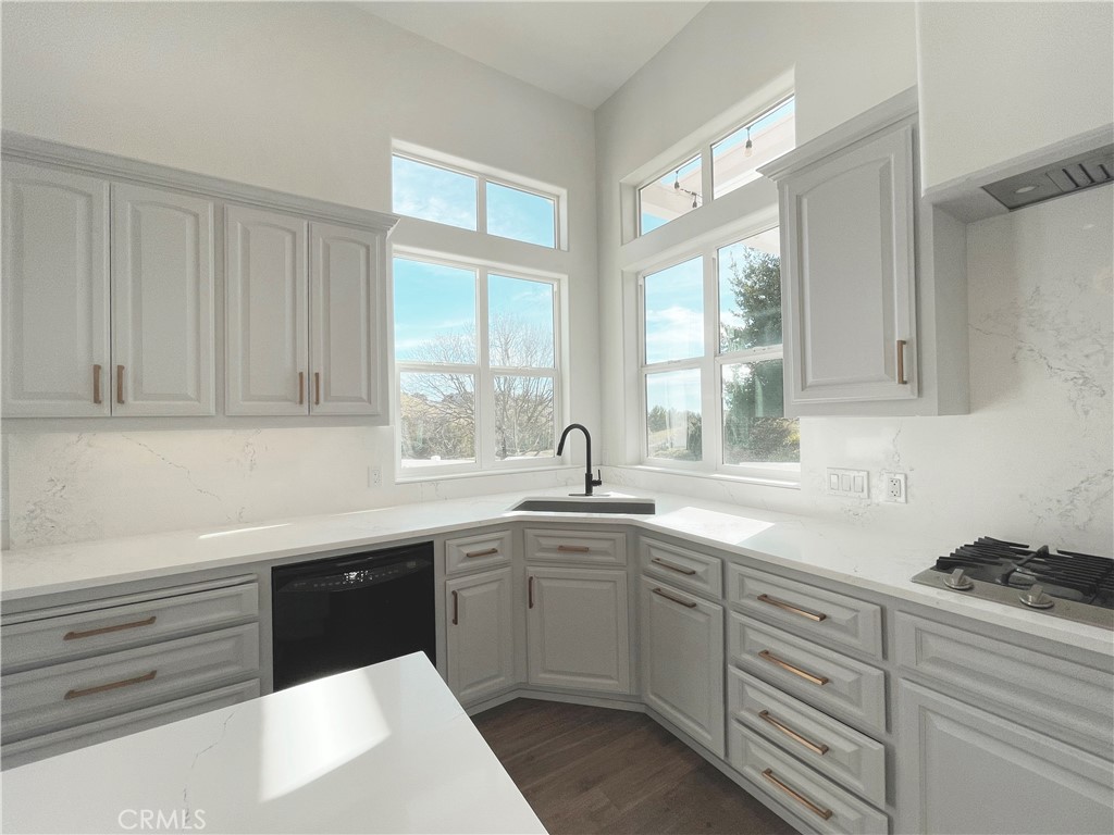 8560 Corriente Road Atascadero, CA 93422 - Photo 13 of 53 a kitchen with a sink and cabinets