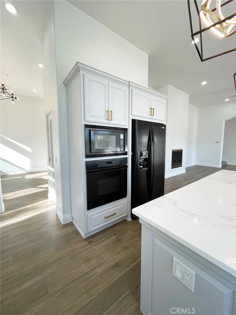 8560 Corriente Road Atascadero, CA 93422 - Photo 15 of 53 a kitchen with stainless steel appliances and white cabinets