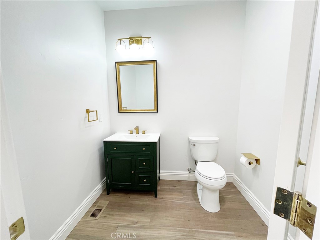 8560 Corriente Road Atascadero, CA 93422 - Photo 19 of 53 a bathroom with a toilet sink and mirror
