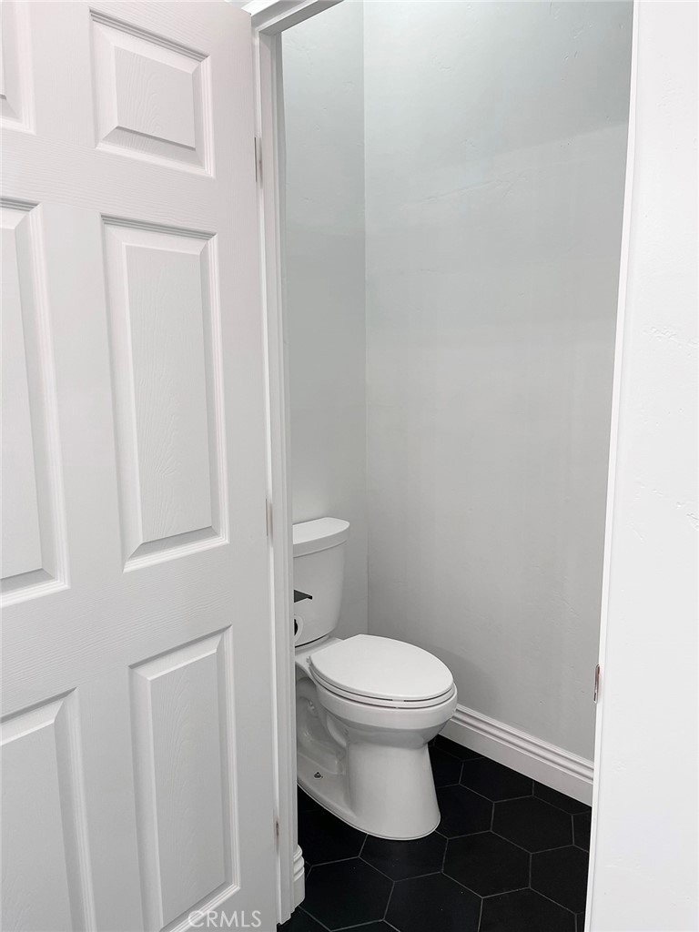 8560 Corriente Road Atascadero, CA 93422 - Photo 28 of 53 a white toilet sitting next to a white cabinet