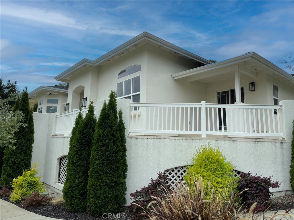8560 Corriente Road Atascadero, CA 93422 - Photo 3 of 53 a front view of a house with a garden