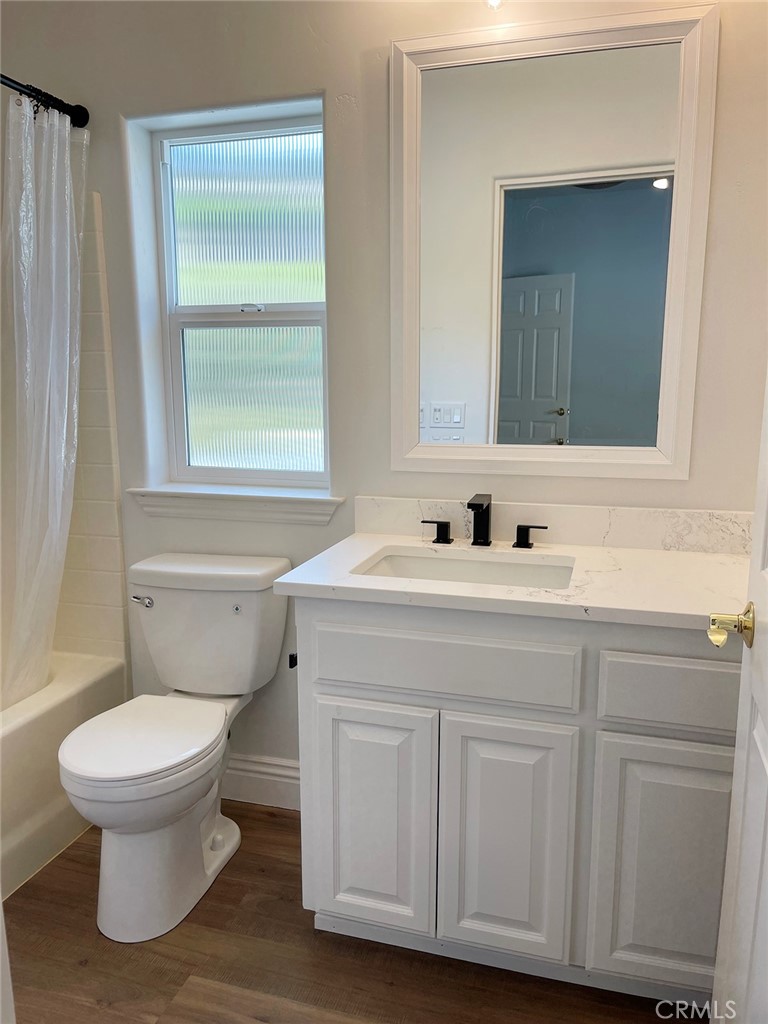 8560 Corriente Road Atascadero, CA 93422 - Photo 37 of 53 a bathroom with a toilet sink and mirror