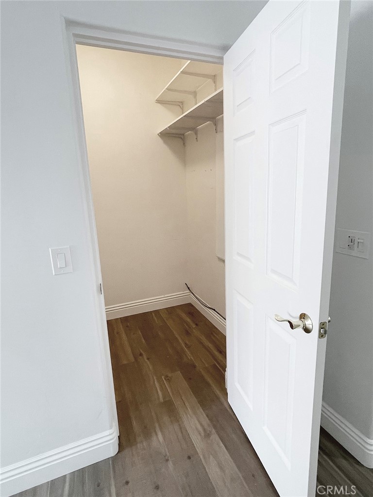8560 Corriente Road Atascadero, CA 93422 - Photo 42 of 53 an empty room with wooden floor and a window